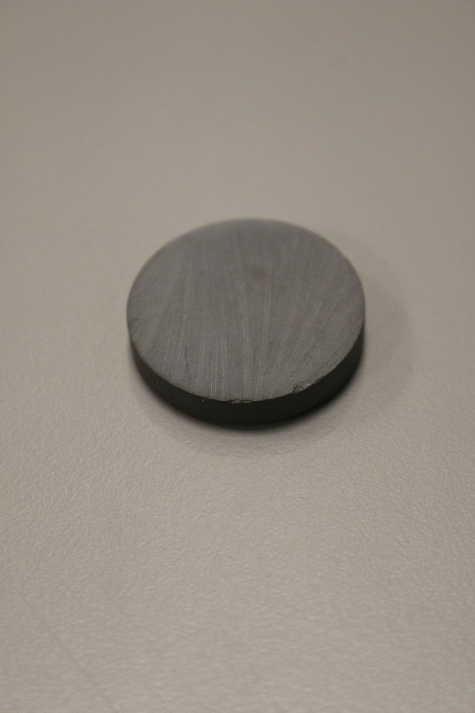 We tried more expensive neodymium magnets, but found that disk magnets about the size of a nickle or quarter work just fine.