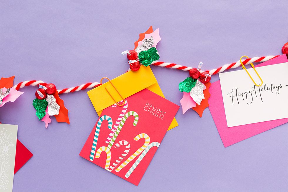 We\u2019re constantly on the lookout for fun AND tasty ways to deck the halls. That\u2019s why we partnered with Hershey to sweeten the season with a DIY holly garland made out of HERSHEY\u2019S Holiday KISSES.