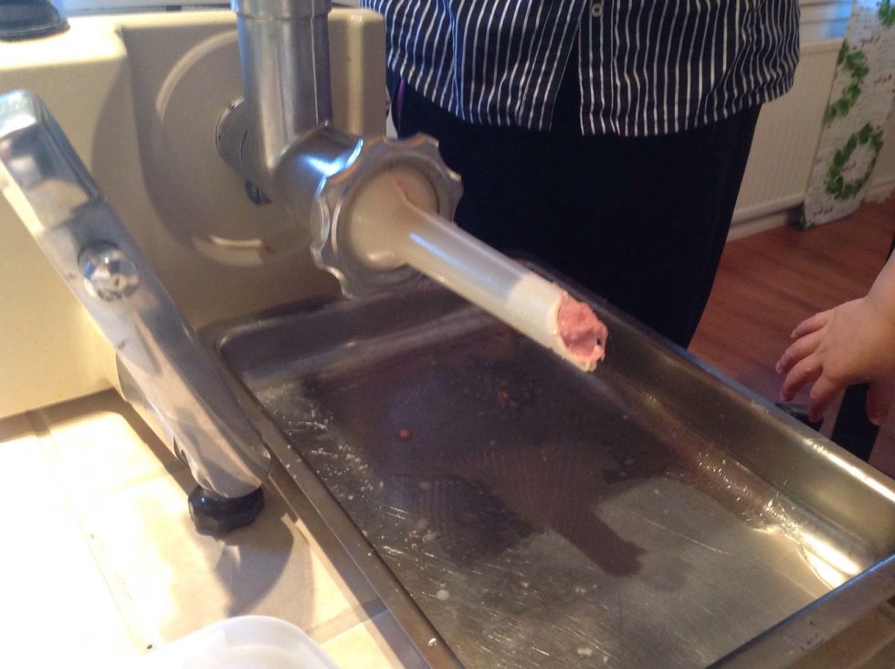 We use a kitchen machine to make the sausage, if you don't have one, you can use a funnel. It is much harder but it works, takes longer time....