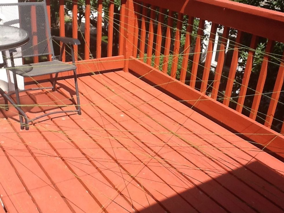 We used a deck for the course. Imagine crawling though the netting and trying not to touch the yarn. No other rules.