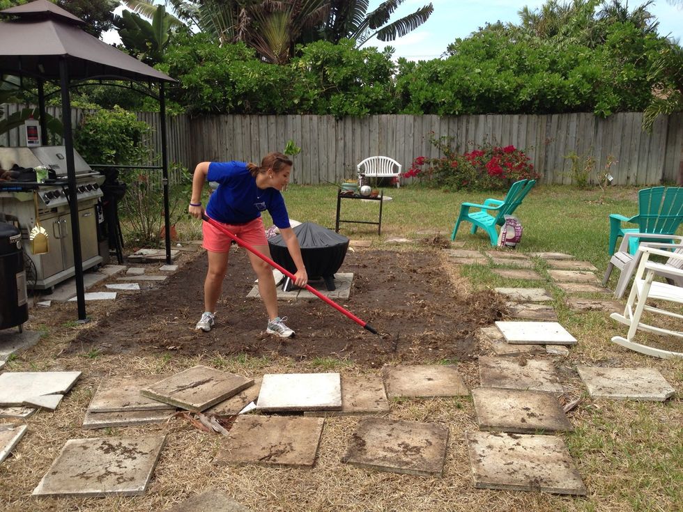 We used a metal rake and hoe to remove grass and loosen soil.