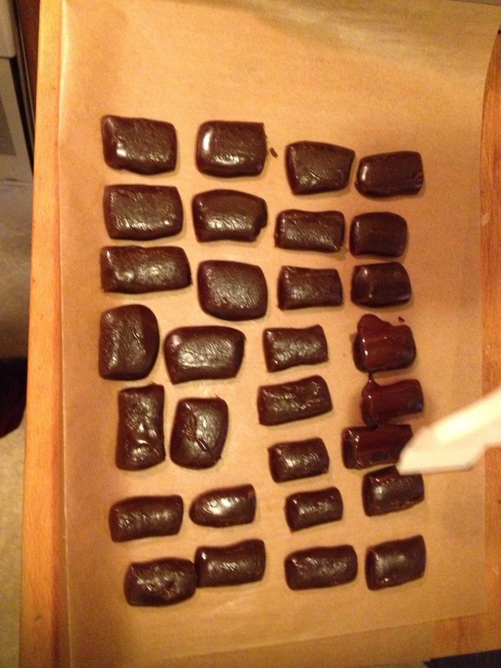 We used a plastic brush and covered the sides and the top. Doing it this way gave us some leftover chocolate.