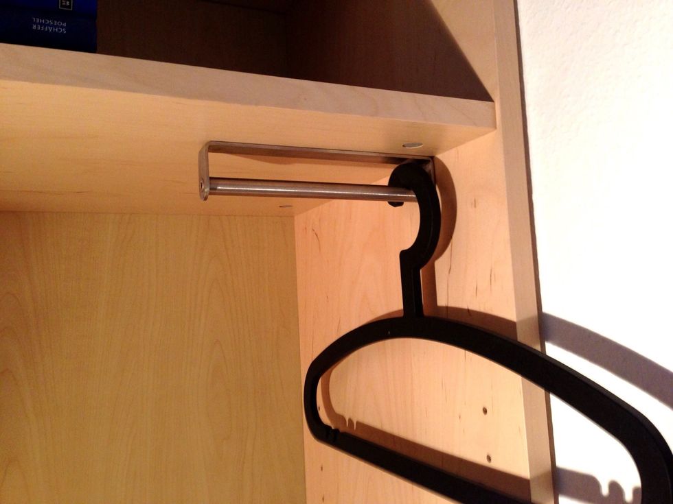 We used a short handle as a clothes rail. This handle is from IKEA (GRUNDTAL), it is no longer available, I found it in our basement. But you should be able to use any other handle like this as well.