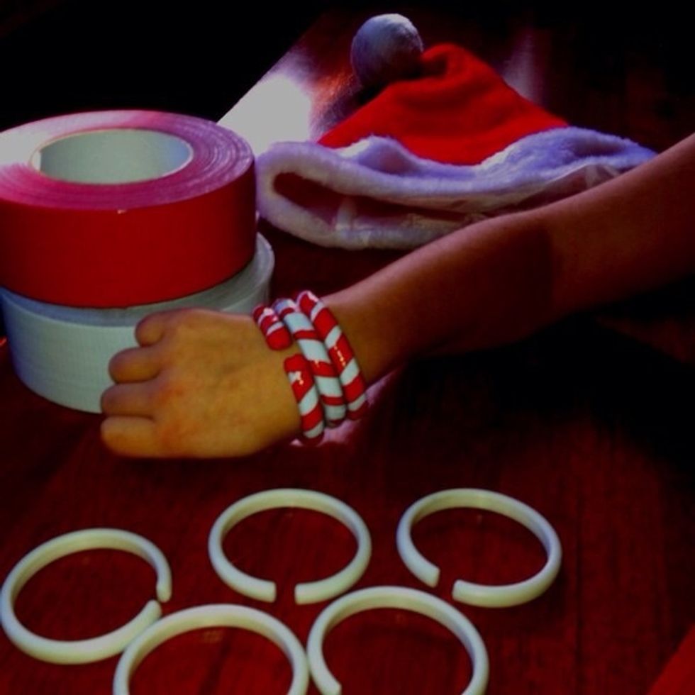 We used old shower curtain rings that were really simple, just a plastic circle with a notch cut out of it to fit over the shower curtain rod. My daughter likes this type best.