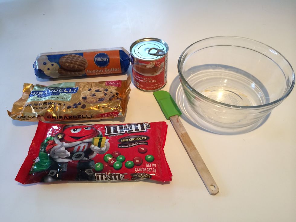 We used two rolls of peanut butter cookie dough, but any kind of cookie dough will do - refrigerated or homemade.  You will want enough to cover the bottom of the cookie sheet completely.