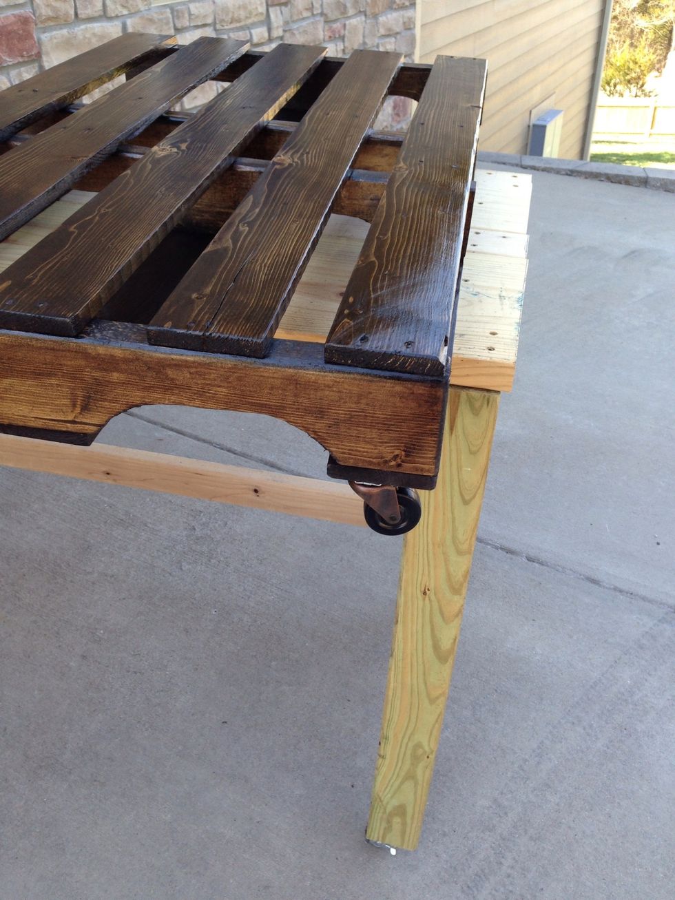 We were aiming for a low rider coffee table, so we found caster wheels that were rustic colors and rose up just 2". You can add a spacer or use bigger wheels. Screw wheels into bottom corners.