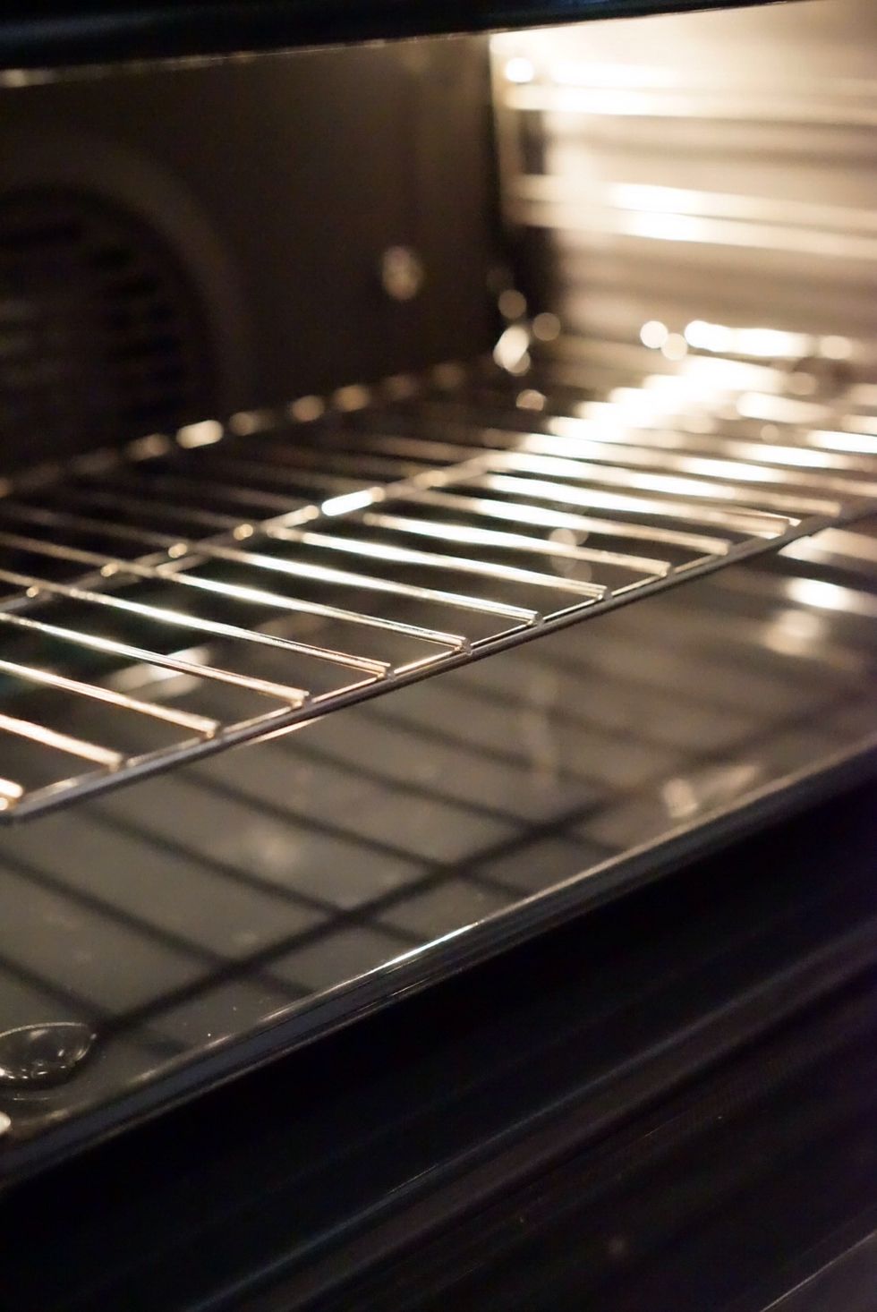 We will be baking with steam, put the pan that will be holding ice in to the bottom rack of the pre-heating oven now.