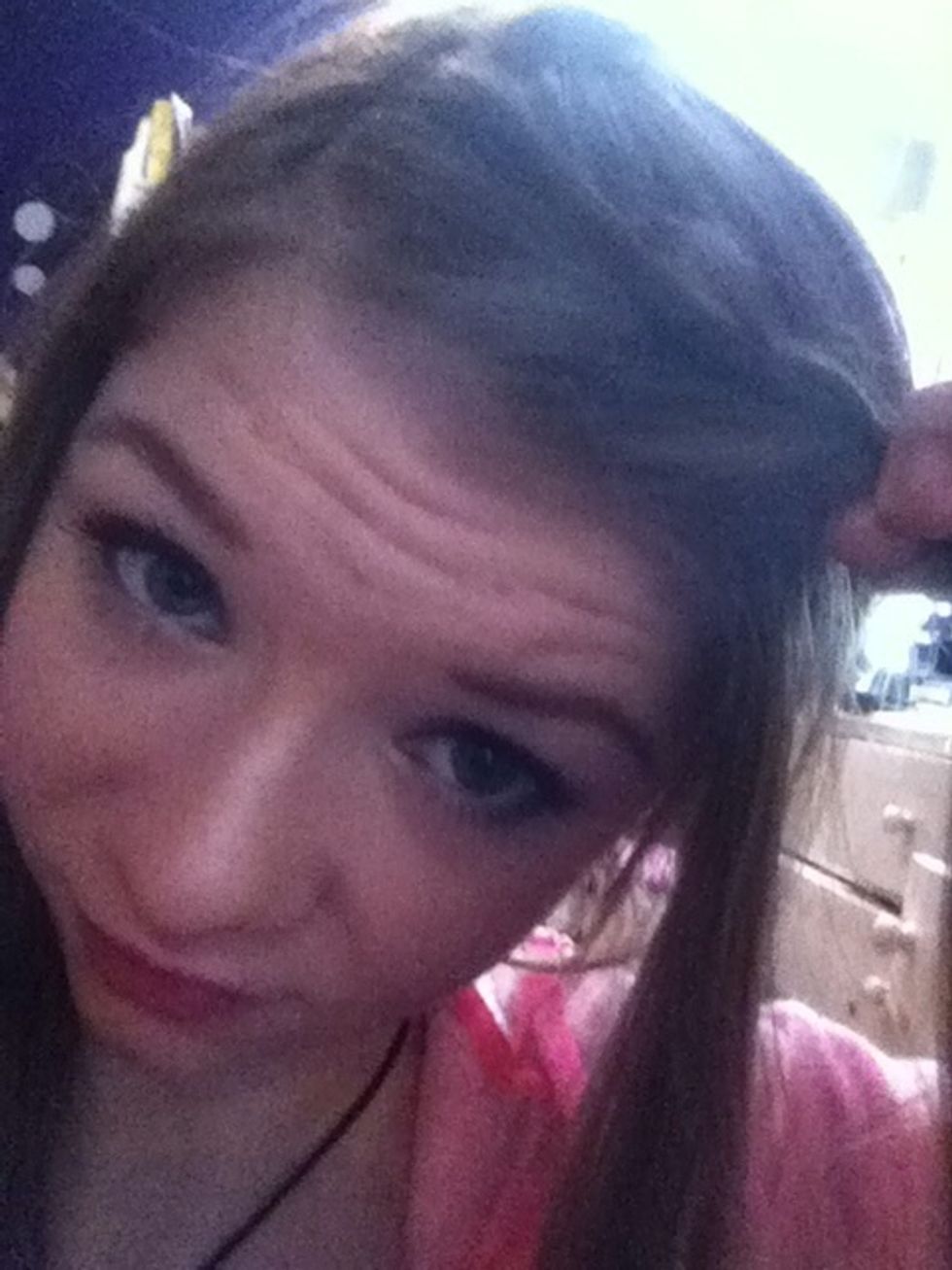 We will be French braiding these sections, adding small pieces of hair to the front piece as you go down