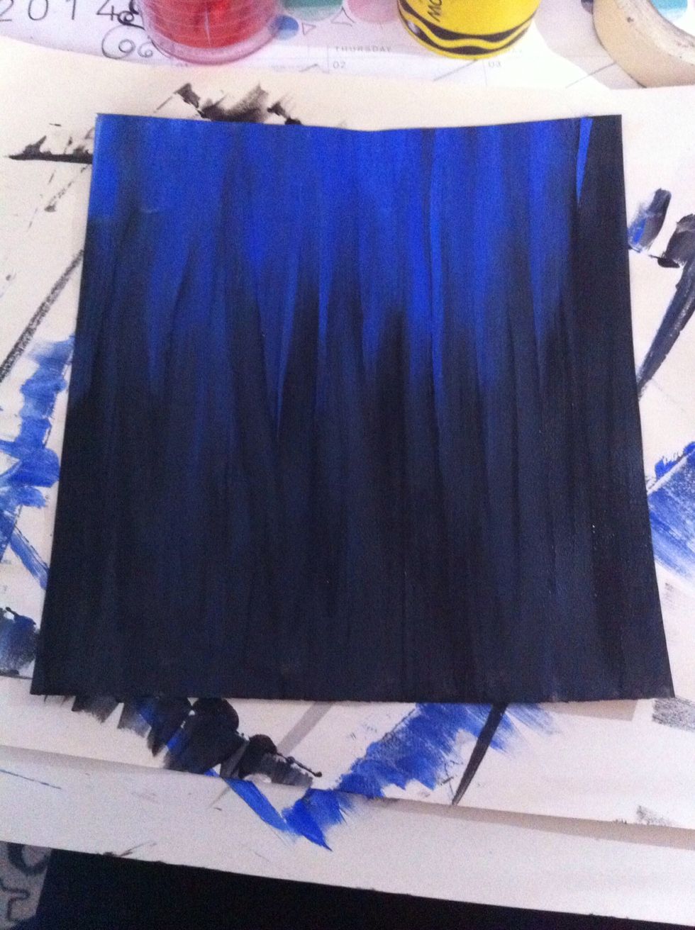 We will start by painting a background. It is totally up to you on how much texture or color you want in the background. I chose to mix black and blue with smoother texture.