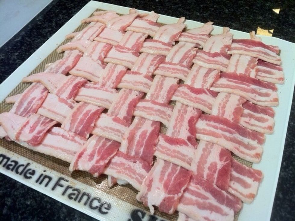 Weave the bacon.  It's easier than it looks.  Bacon should be COLD for this step.  Be patient.  It takes time but is an impressive maneuver.  I used a "Silpat.".  A cookie sheet works just fine too.
