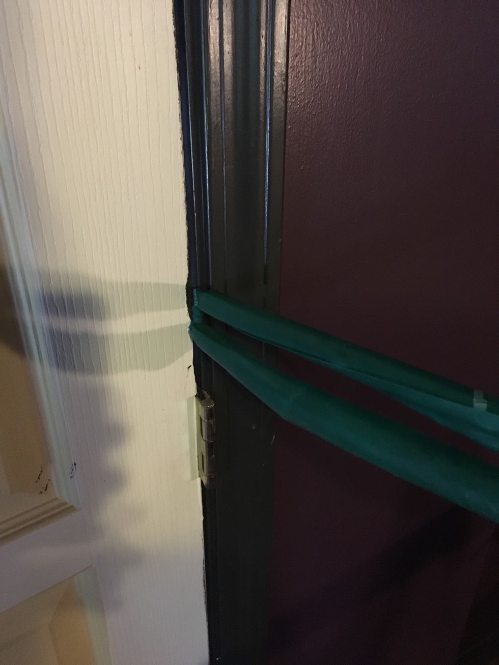 Wedge a resistance band into your door frame. If you are at the gym, using a cable with a low weight works for this. You want it about elbow height for this exercise.