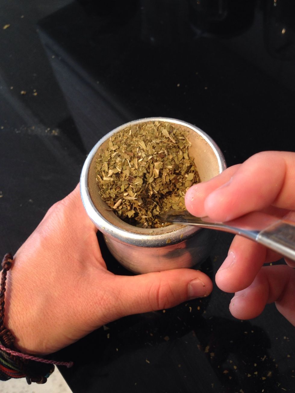 Wedge the bombilla underneath the "montanita" of yerba mate