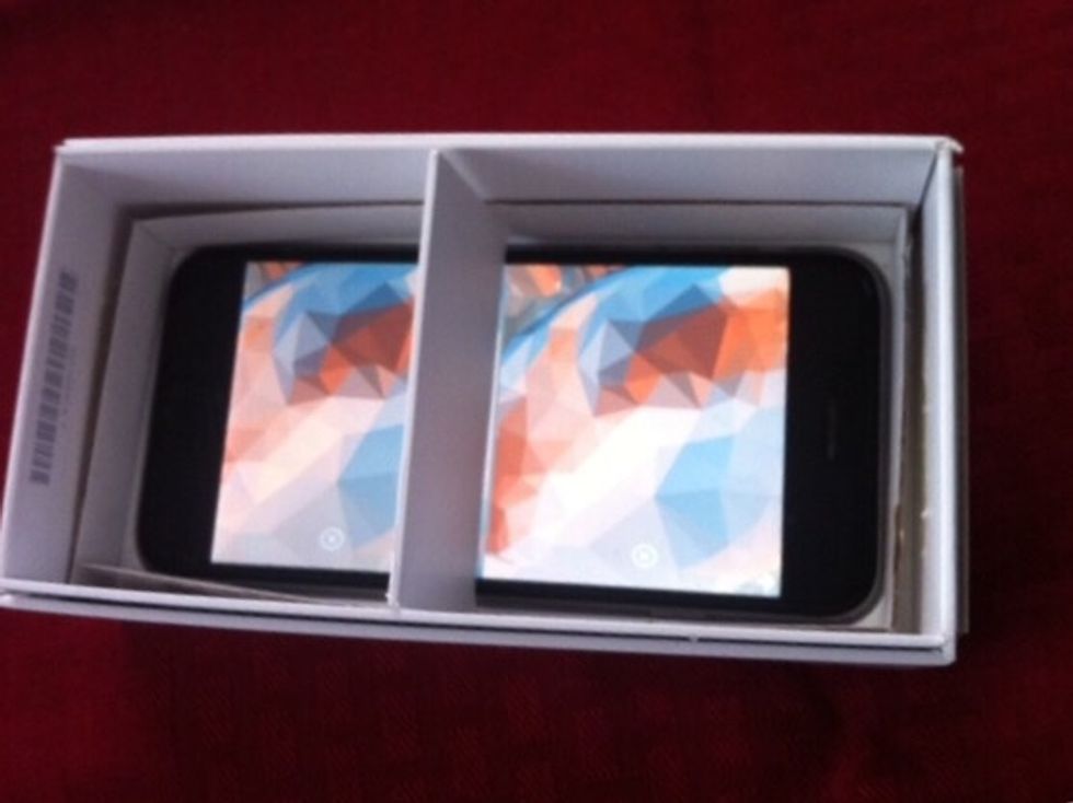 Wedge the divider so that its centered between the two VR screens. The thin strip going around the phone will help hold this divider in place.