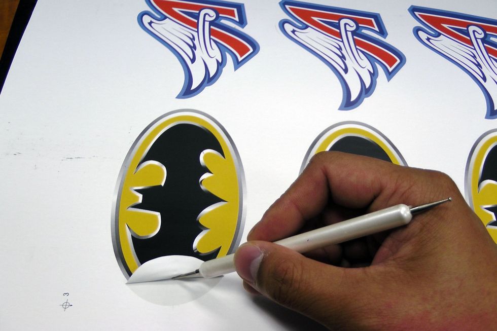 Weed out the images and designs from the transfer paper.