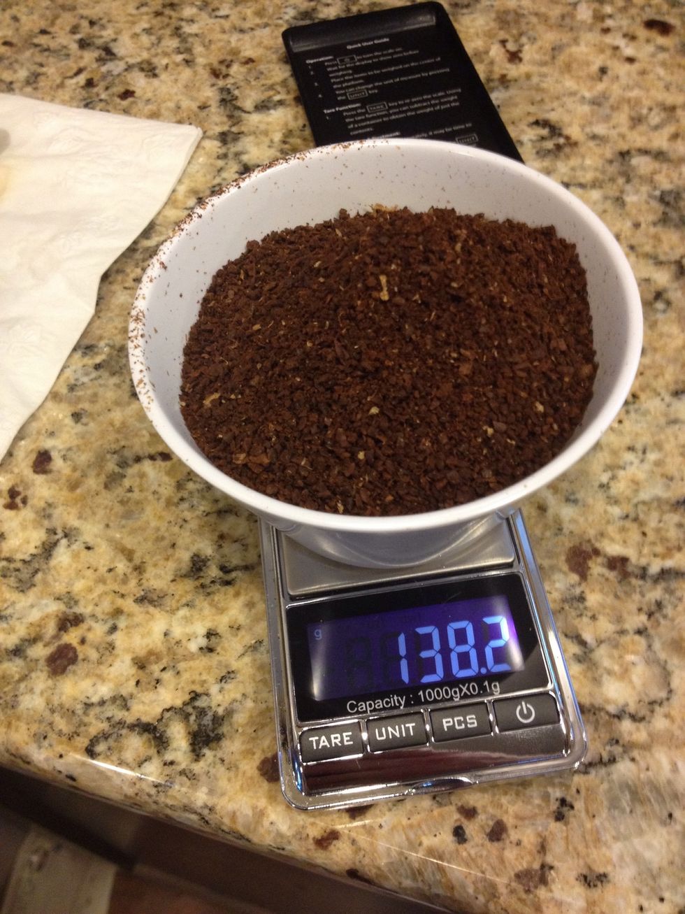 Weigh out 70 grams of ground coffee- Note - the ramekin weighs 68.2 grams.