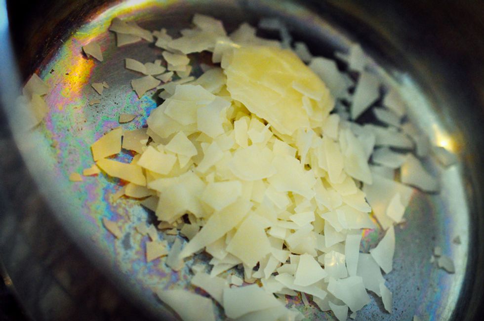 Weigh out your emulsifying wax into the saucepan. Emulsifying wax is a waxy substance that makes creating water-oil emulsions super easy. It's easily available online. Do not use beeswax instead!