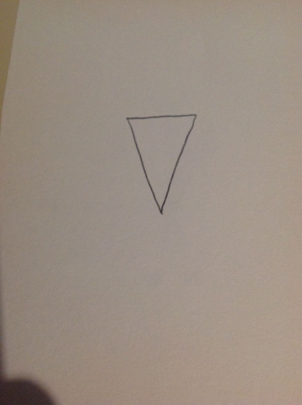 Well first, you need to draw an upside down triangle, just like an ice cream cone for the body.