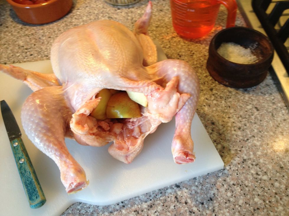 Well this is not a charming posture for any bird. Stuff your chicken with parsley and apples if you got them. This will add taste and moisture to your chicken.