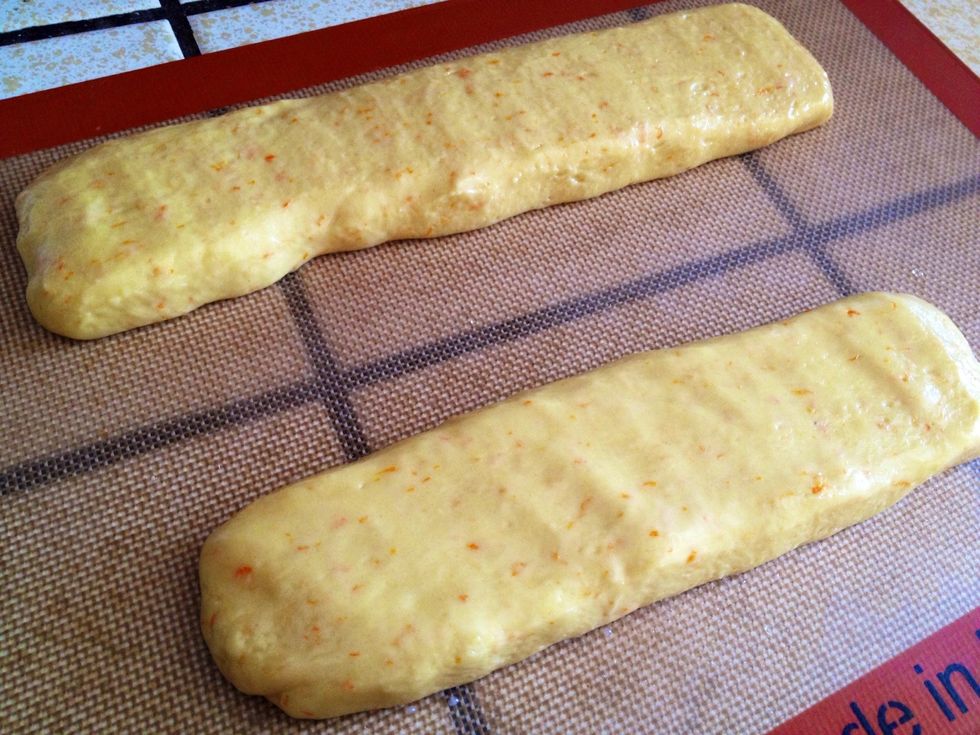 Wet hands slightly so the mixture does not stick to hands. Take half of mixture and make a log and place on baking sheet (roughly 2 inches wide). Do the same with the remaining half of the mixture.