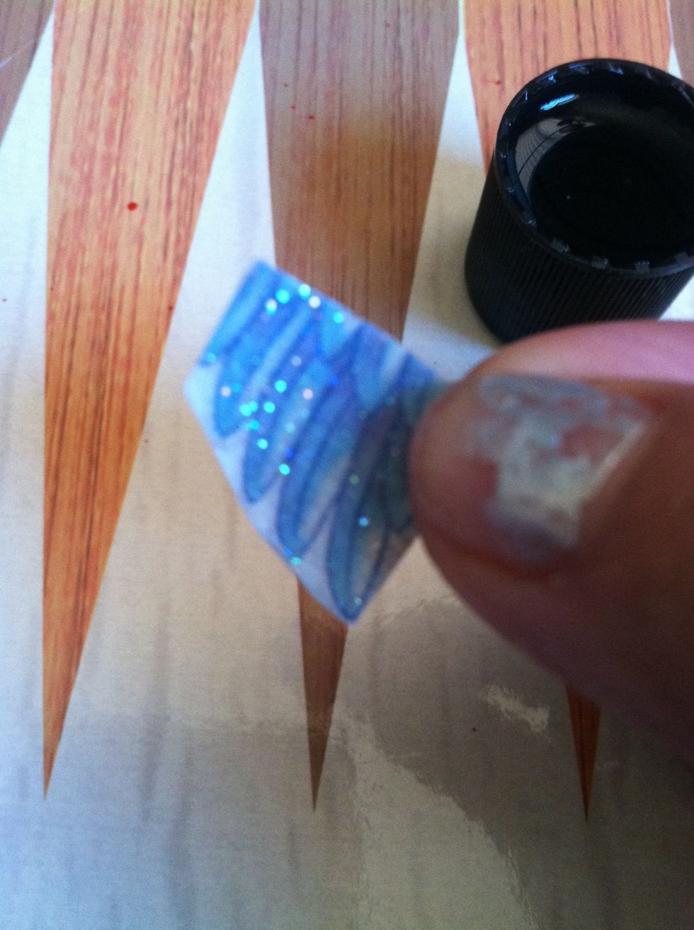 Wet piece! Carefully pull clear plastic film off.