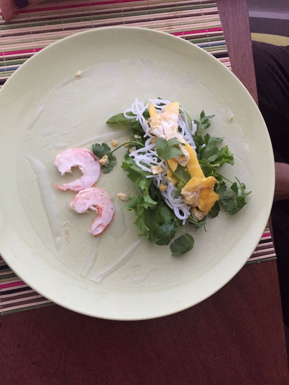 Wet rice paper. Add lettuce, cilantro, mint, and noodles, and cooked egg (cooked like an omelette), and shrimp and roll up