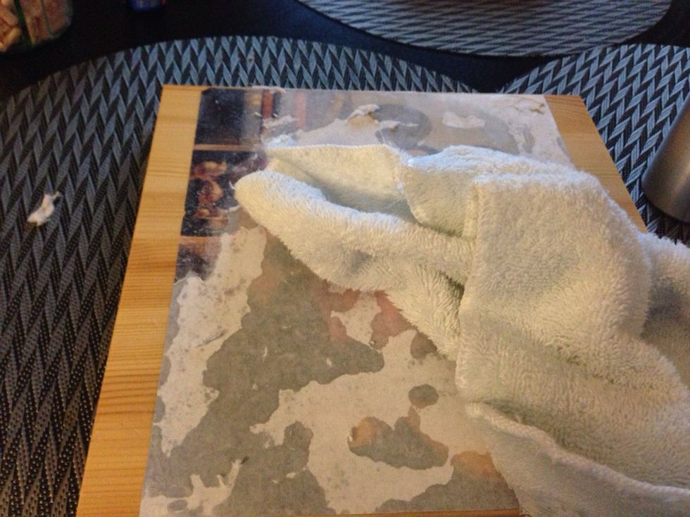 Wet the pic, you will see it begin to pop through the wet paper. Now the next step is fun, but requires care. Gently begin to rub off the paper. I used a wet facecloth for the first layer.