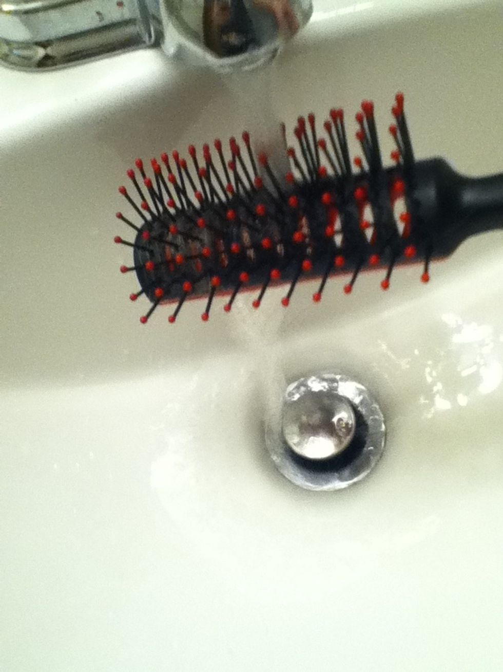Wet your hair brush and brush out your hair (it is easier to work with when hair is a bit wet).