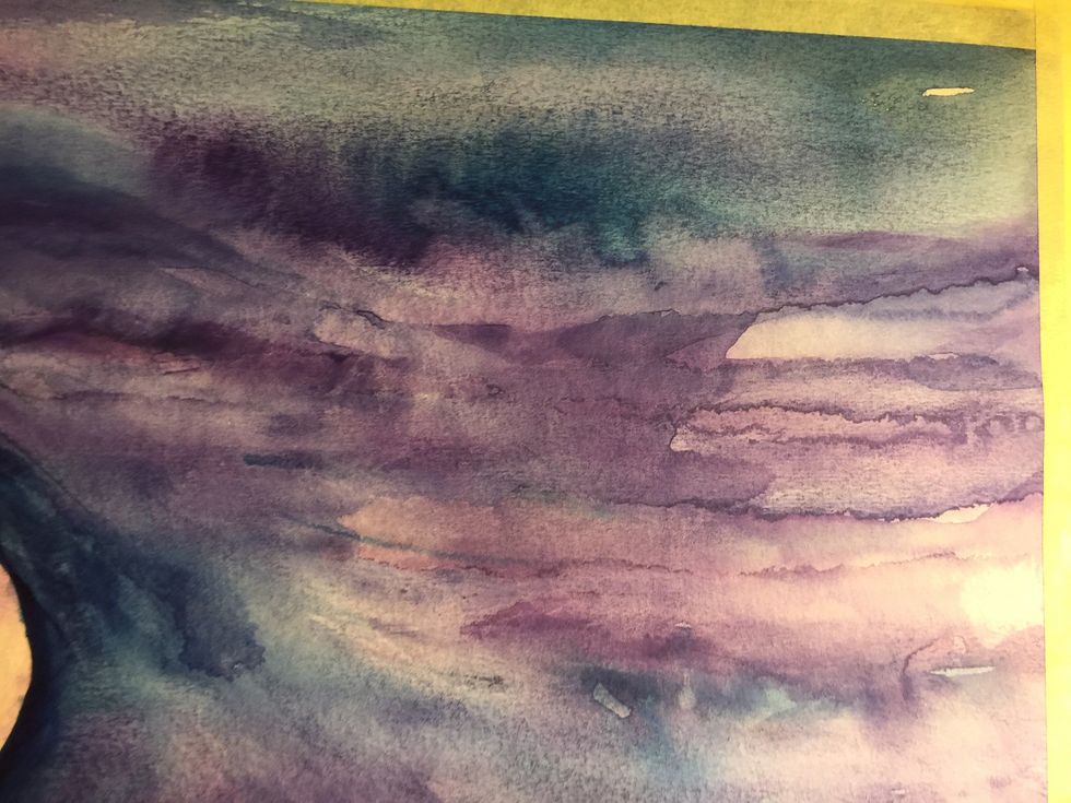 Wet your watercolor Paper with clear water and drop in watercolor paints.  Turn the paper in the direction you want the color to flow.