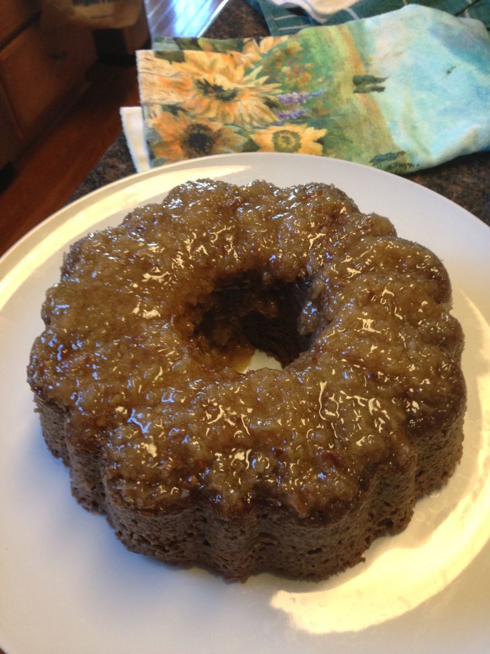 Whala!! Flip it out on a platter and you are all done! Don't you love how the frosting has sunk and iced your cake? Perfect for serving!