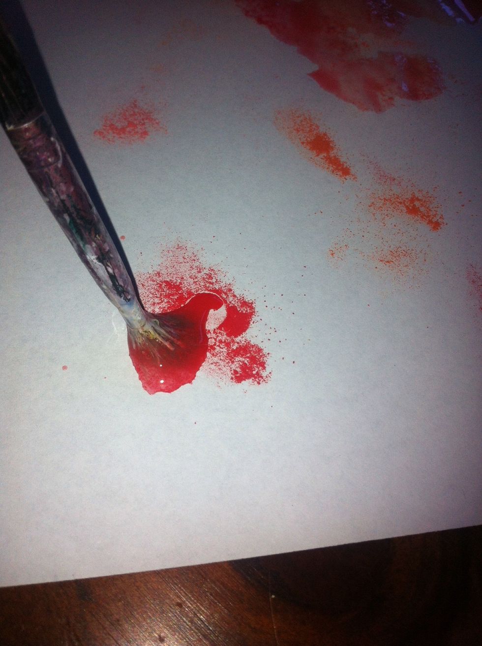 What i did was decorate my own paper if yu arnt intrested you can use whatever paper you like and go straight to flower making precess. But all i did was dab around the paper with red orange and pink