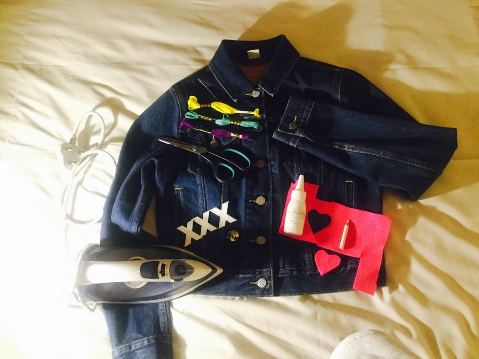 What you'll need:   Denim jacket, iron-on letters or badges, fabric glue, felt, scissors, iron, embroidery thread and needle, markers, fabric paint, ribbons etc - use your imagination.