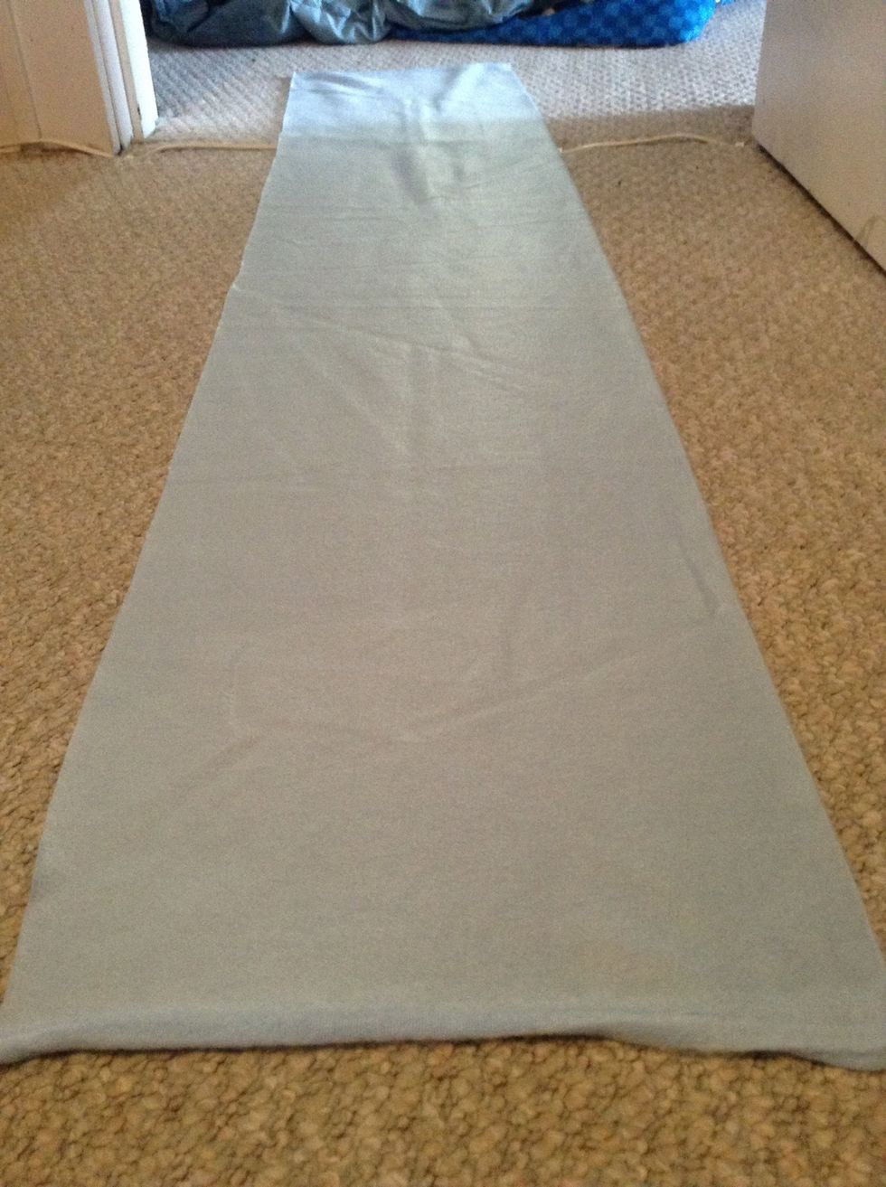 What you wanna do first, is lay it out on the floor or a table. Make sure the right side is facing upwards.