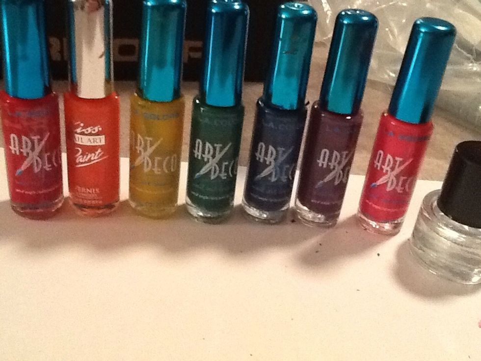 What you will need is rainbow colors or any colors, clear coat and paper.