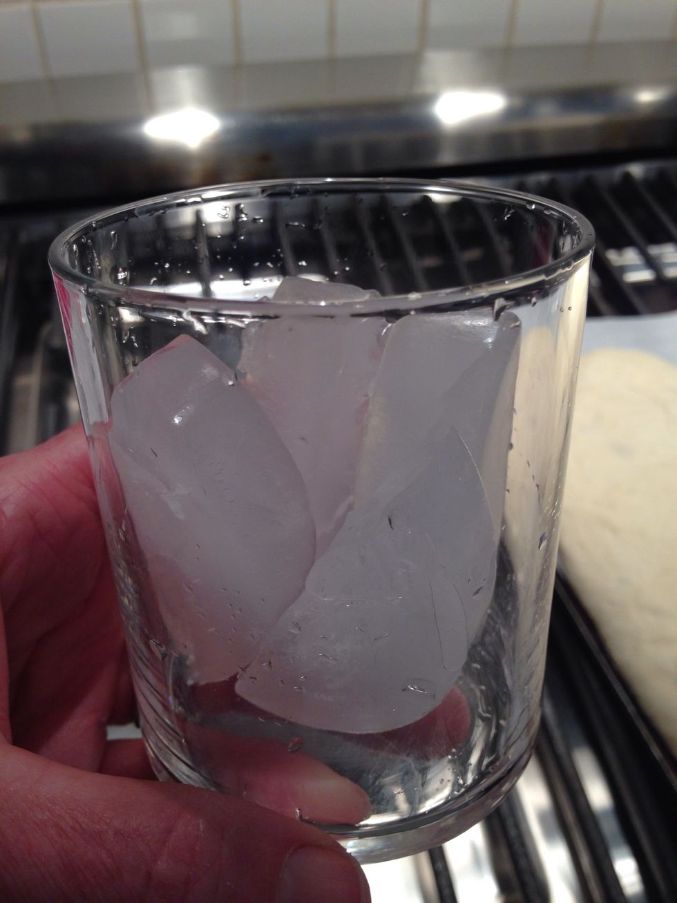 When 30 minutes have passed, and the oven is 500 degrees, throw this many ice cubes in the oven- not on the stone. Remove towels, then carefully slide the loaves, and the paper, onto the stone.
