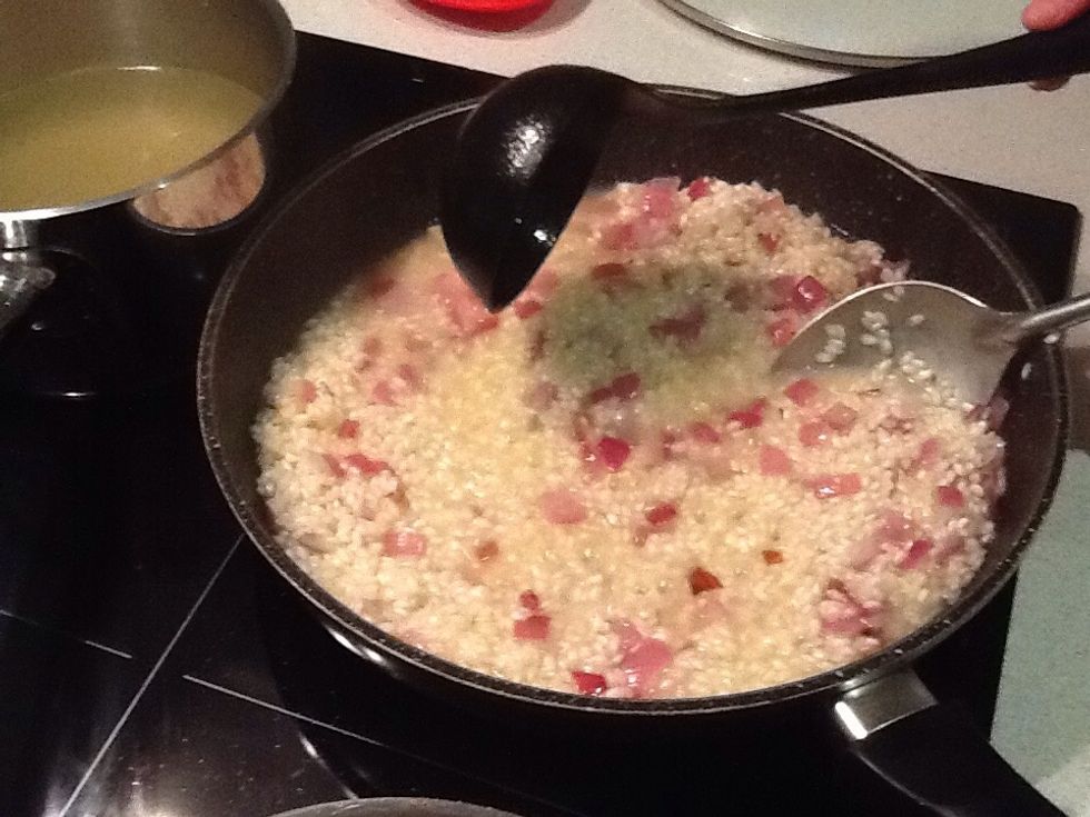 When absorbed add a ladle spoon of stock and stir until absorbed. Repeat twice. The rice will look creamy as the starches are released.