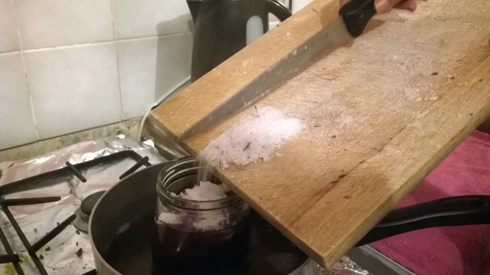 When adding in more bits be careful. Try this method to distance yourself from the possibility of hot water splashing back - or worse, hot wax splashing back.