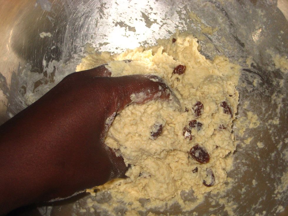 When all the flour is fully mixed in, scrape off the sticky dough from the bowl.......