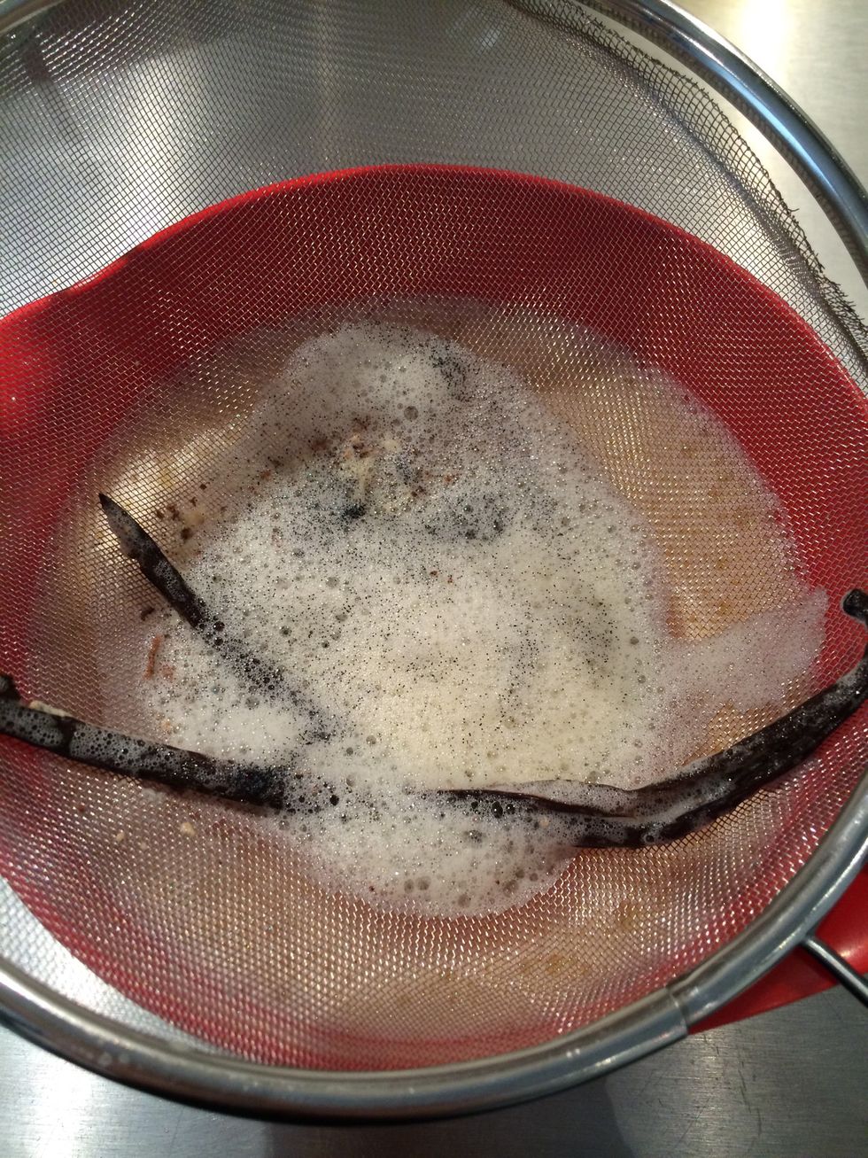 When all the milk is incorporated. Strain to take out all curdling and the vanilla bean