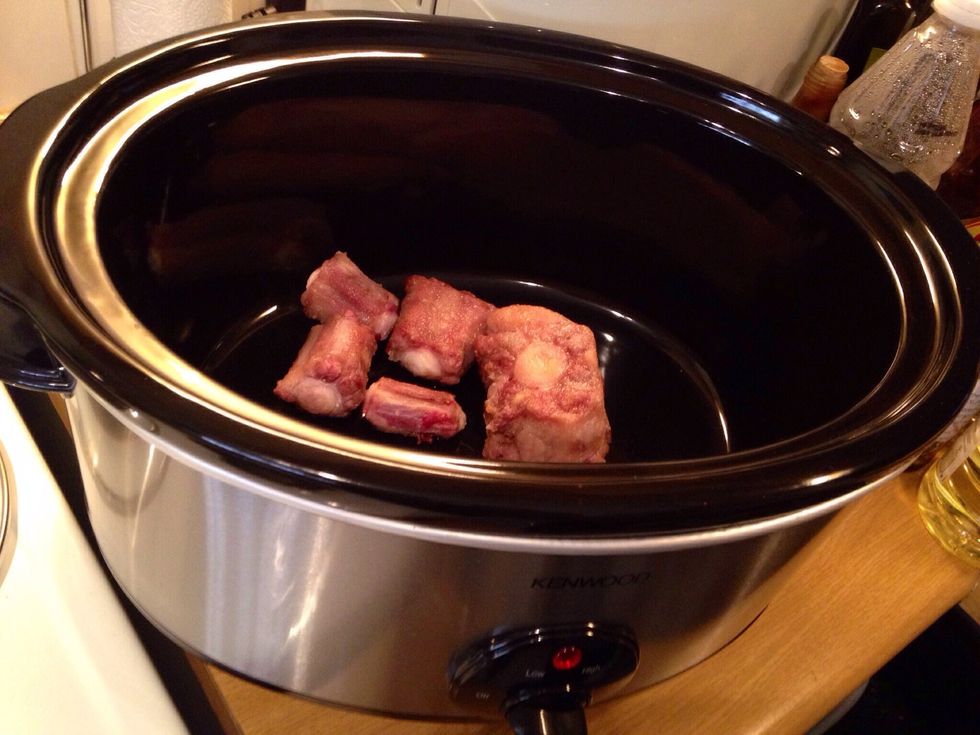 When all the oxtail meat has been browned place in the slow cooker or oven dish. If doing in the oven it will be cooked for several hours at low temperature in a covered dish.