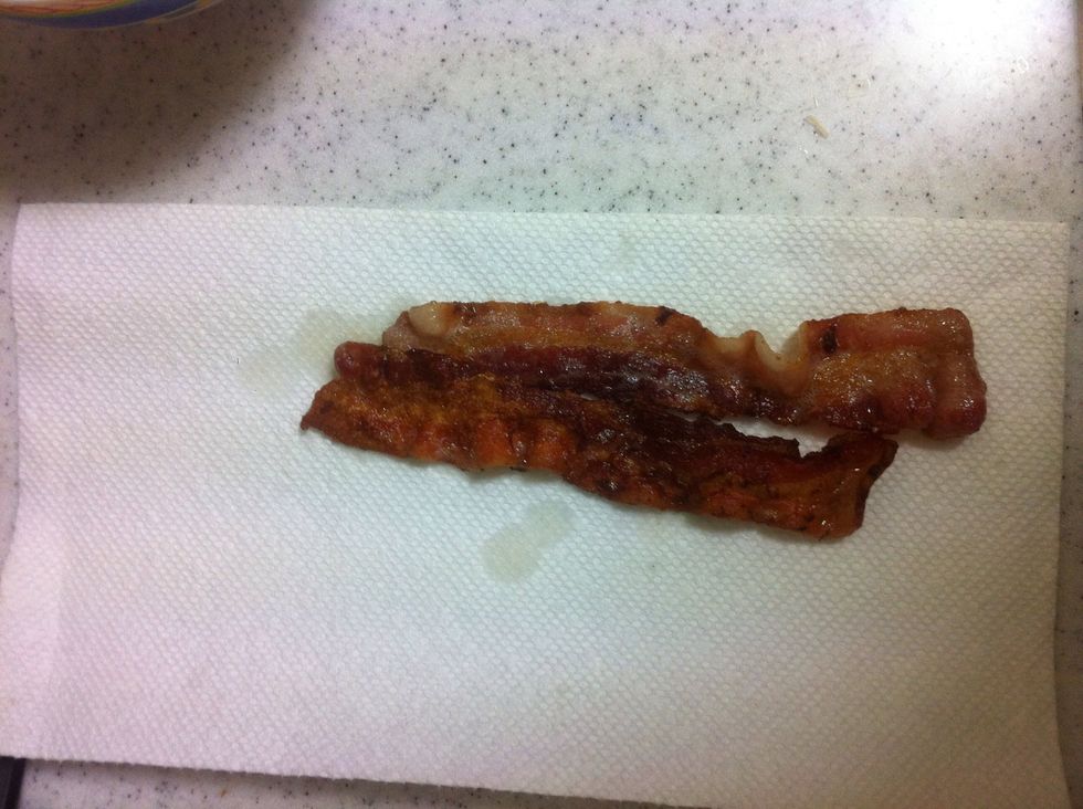 When bacon is done, place on a paper towel to get rid of the excess grease