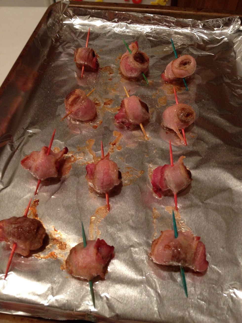 When bacon starts to brown, flip and return to the oven. Watch carefully as you don't want them to burn. When they look crispy on both sides, remove from oven to cool.