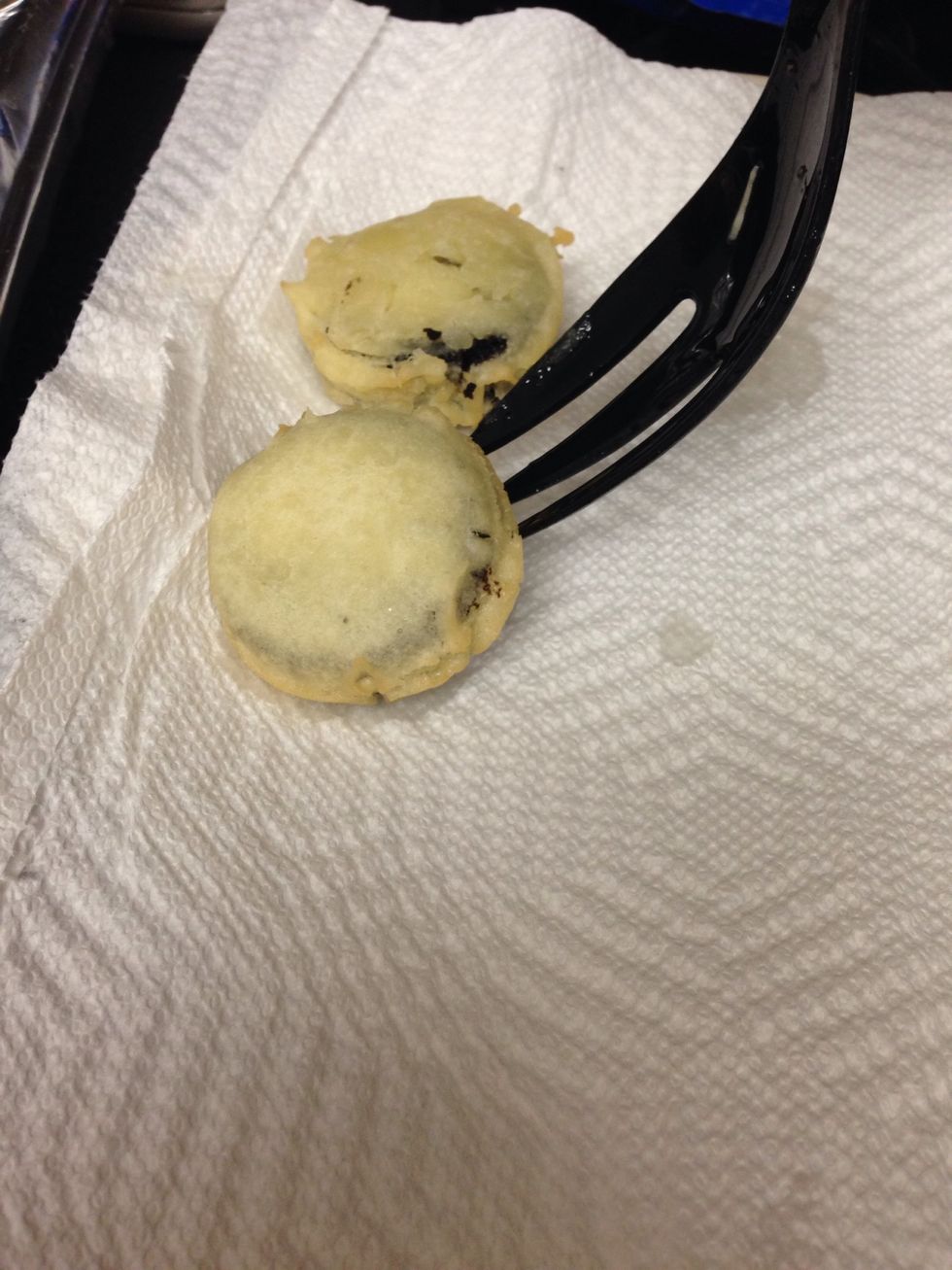 when batter is firm, place Oreos on to paper towel on plate