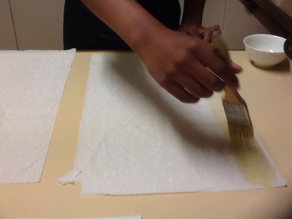 When both mixture are finished combine them and start on the pastry. Using the 2 tablespoons of olive oil lightly spread a thin layer on top of a tripled up sheet of pastry.