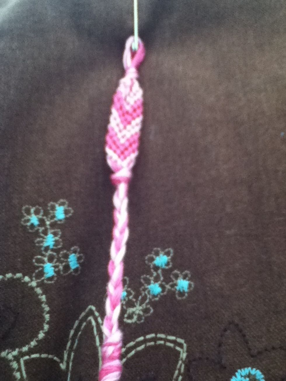 When bracelet is desired length, tie a knot. The either braid a few inches and tie off or thread on the button.