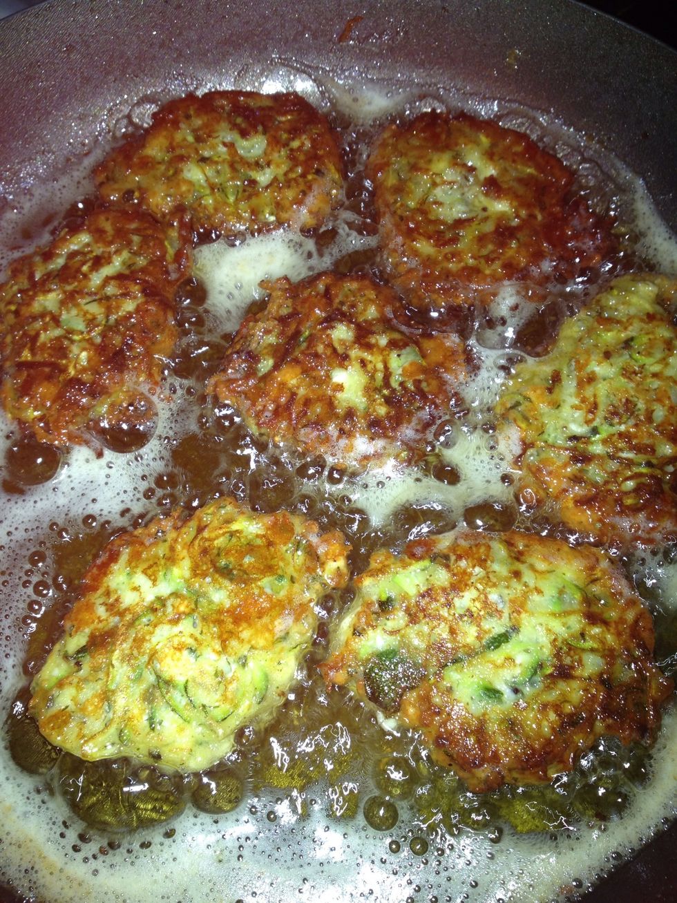 When browned on both sides like the top ones in the image, take out and leave on kitchen roll to absorb the excess oil.