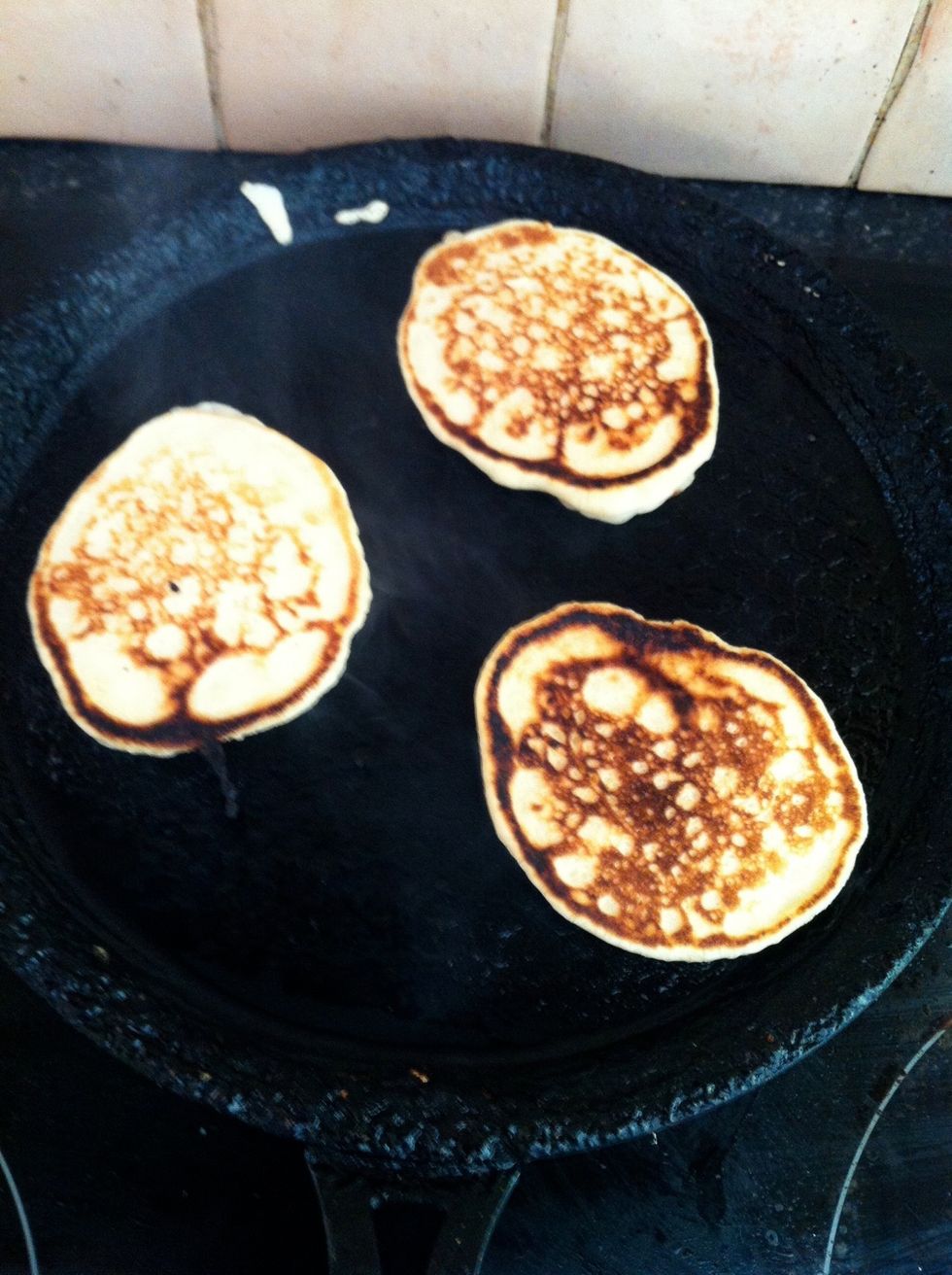 When bubbles form, flip the pancakes. (because the recipe makes so many I keep the  pancakes warm in the oven until they're all ready)