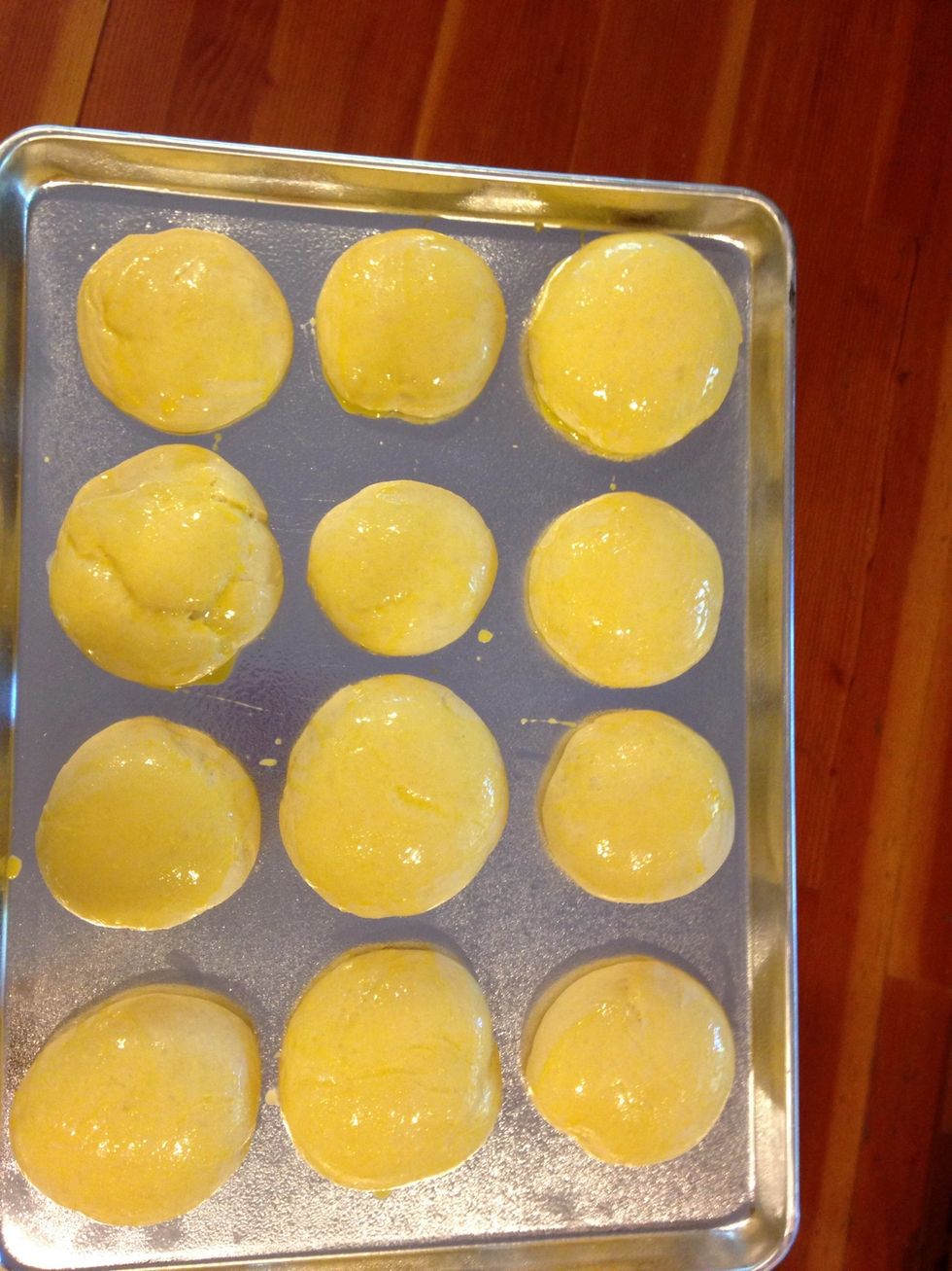 When buns have risen, brush them with and egg wash, and bake for 10 min in a 400 degree Fahrenheit oven.