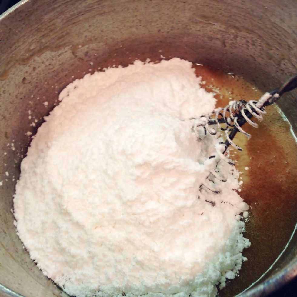 When butter has browned, remove from heat and add two cups confectioner's sugar.