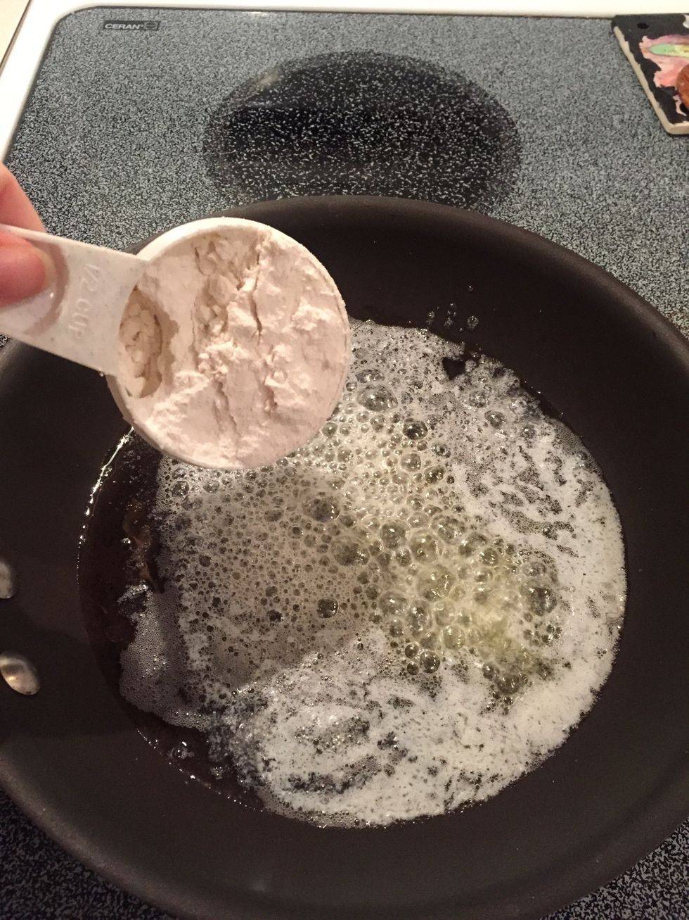 When butter melts, add flour and stir.