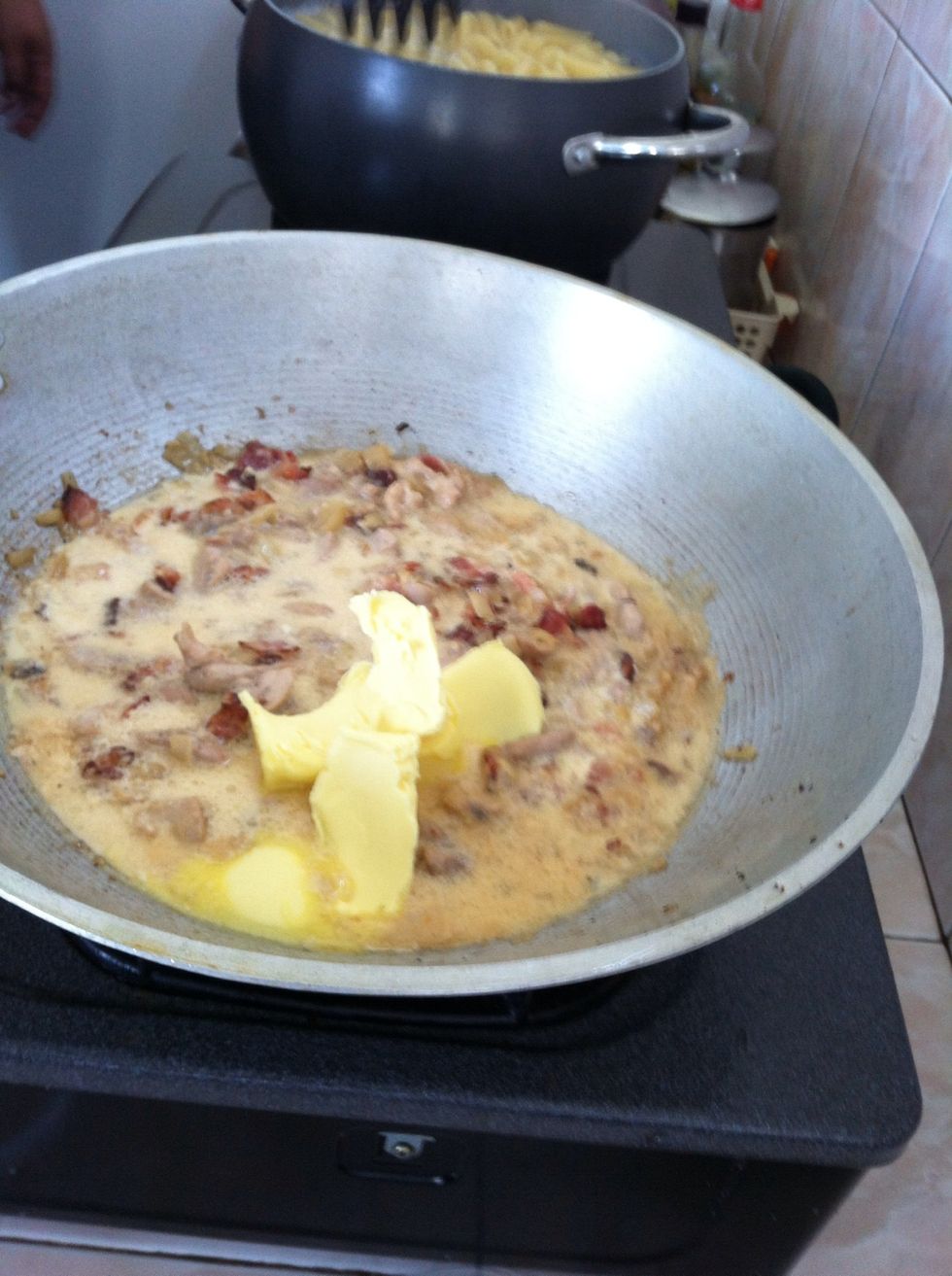 When chicken is already cooked, put the milk, butter and bacon
